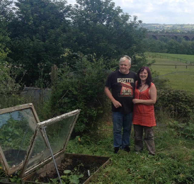 Phil and Helen showing off their view over Reddish Vale